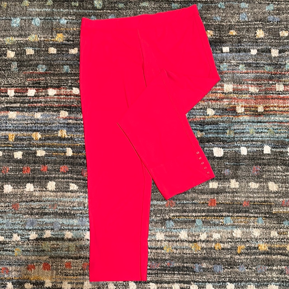 Vibrant red knit crop pants with button trim at ankle